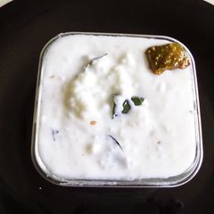 Curd rice with pickles A picture of Curd rice with pickles.