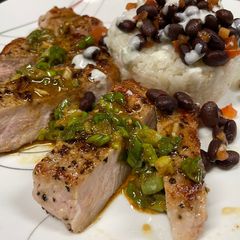 A picture of Pork Chops with Zesty Green Onion Salsa.