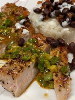 A picture of Pork Chops with Zesty Green Onion Salsa.
