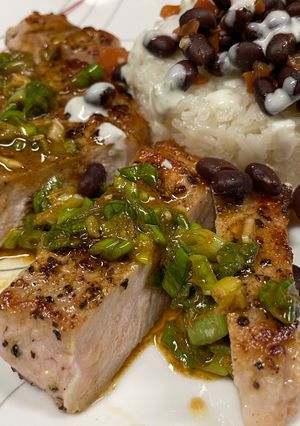 A picture of Pork Chops with Zesty Green Onion Salsa.