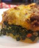 Polenta rellena de espinaca con bolognesa