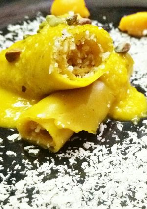 A picture of Shahi mango khandvi with Mango rabari.