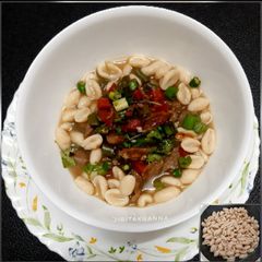 A picture of Cowrie/ Kouri (Handmade cowrie shell shaped noodles) in Soup.