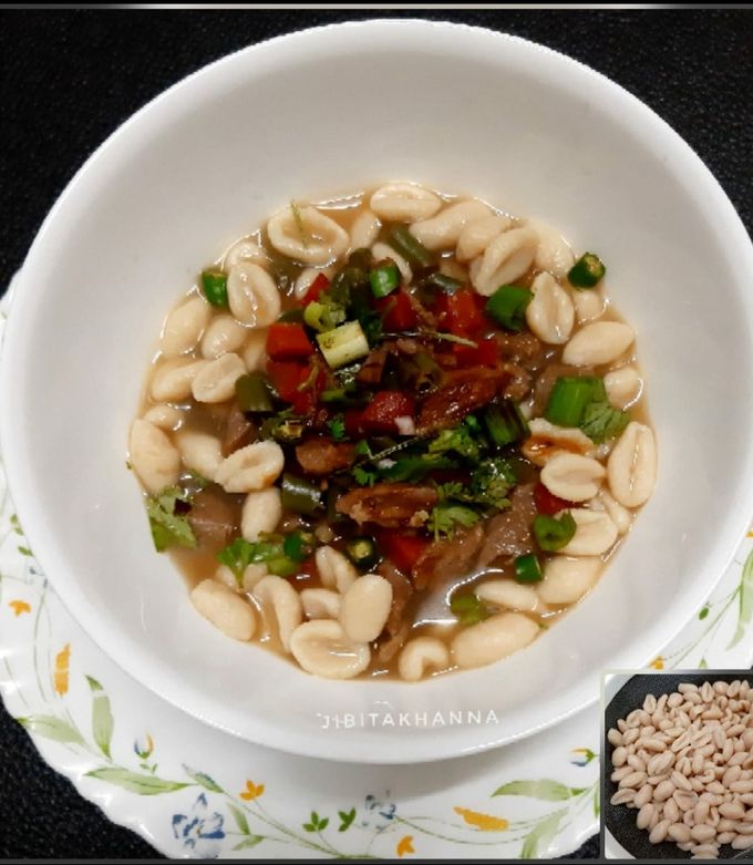 A picture of Cowrie/ Kouri (Handmade cowrie shell shaped noodles) in Soup.