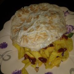 A picture of Fried arish with egg and ketchup.