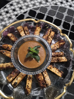 A picture of Paneer fingers with peanut sauce.
