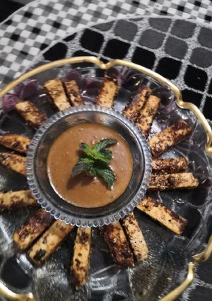 A picture of Paneer fingers with peanut sauce.