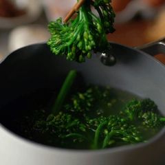 A picture of Charred Broccolini with Roasted Black Garlic Drizzle.