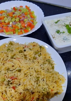 A picture of Mater pulao with kaddu raita and kachumar salad.