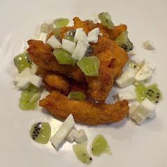 A picture of Tomato goujon with a mozzarella and kiwi salad.