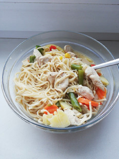 A picture of Tom kha kai with egg noodles.