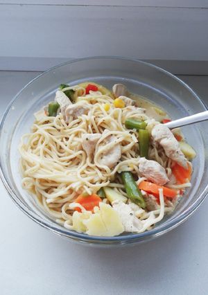 A picture of Tom kha kai with egg noodles.