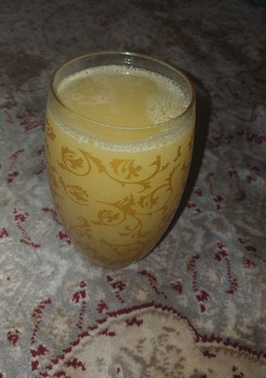 A picture of Paineapple orange and mint leave juice.