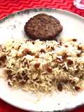Arroz con caracolitos tostados