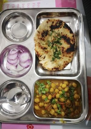 A picture of Stuffed kulche & chole.