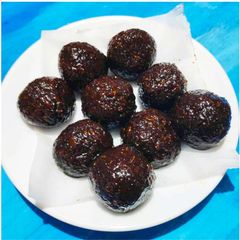 Dry fruits stuffed coconut laddoo A picture of Dry fruits stuffed coconut laddoo.