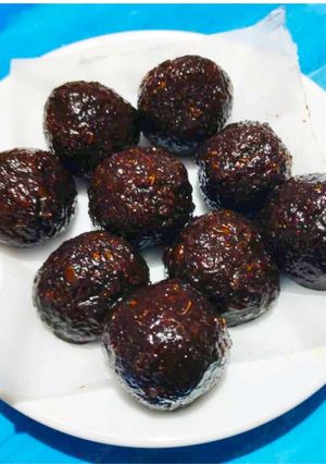 A picture of Dry fruits stuffed coconut laddoo.