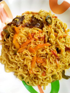 A picture of Noodles with veggies.
