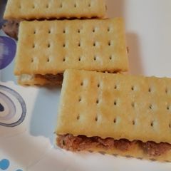 A picture of Butter Crackers with Deviled Ham.