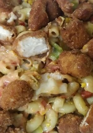 A picture of Spicy macaroni with chicken bites.