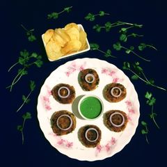 A picture of Fish Cutlet with Potato Chips.