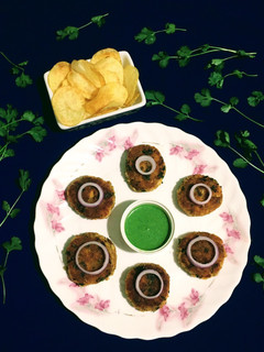 A picture of Fish Cutlet with Potato Chips.