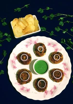 A picture of Fish Cutlet with Potato Chips.