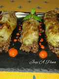 Rollitos de col de carne mixta y crema de pimientos asados