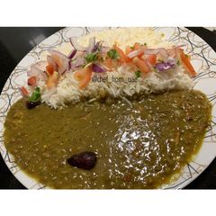 A picture of Masoor Dal with Boiled Rice & Kachumar Salad.