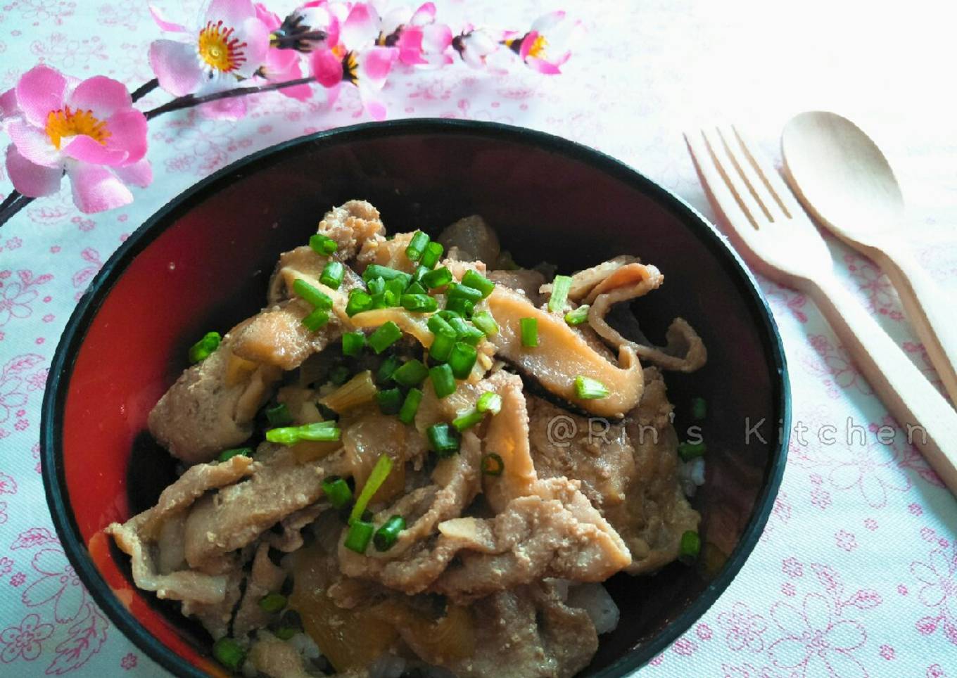 A plate of pork and shitak rice