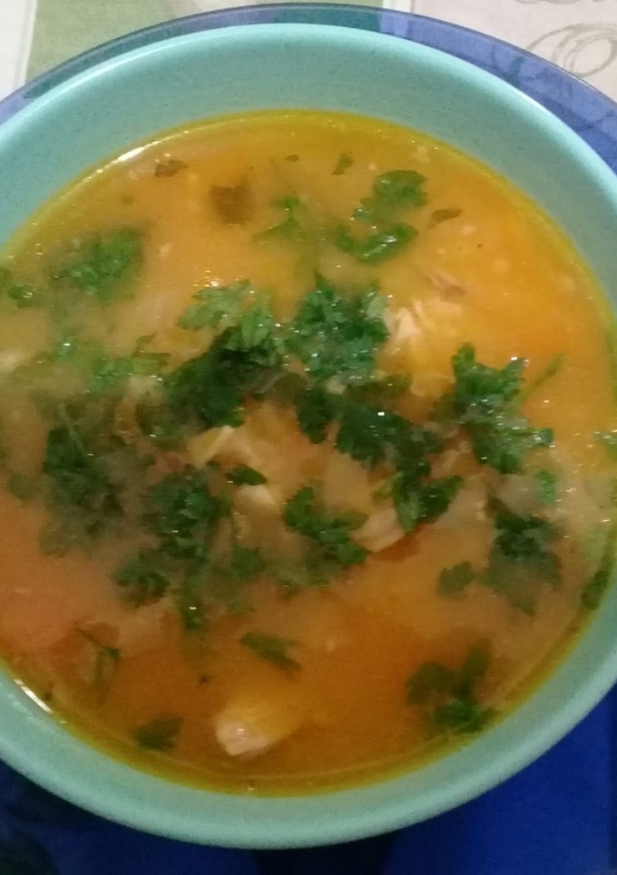 Una foto de Canja de galinha (sopa de arroz con pollo)