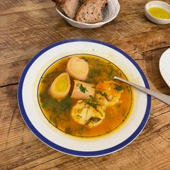 A picture of 🐟 Fish soup, tomato, potato, leek.