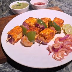 A picture of Peri peri Kashmiri paneer tikka masala.