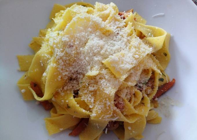 Papardelle with speck and chanterelle mushrooms