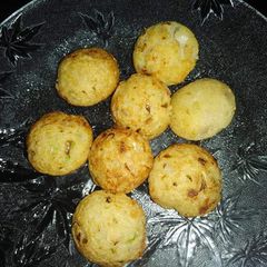 A picture of Moong daal fritters in appe pan.