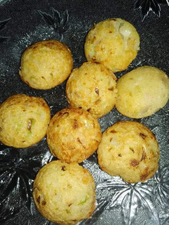 A picture of Moong daal fritters in appe pan.