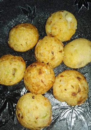 A picture of Moong daal fritters in appe pan.