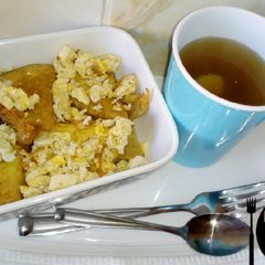 A picture of Golden yam with Egg sauce and Tea.