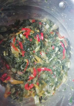 A picture of Spinach with robbot peppers.