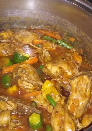 A picture of Spicy chicken with vegetable stew.