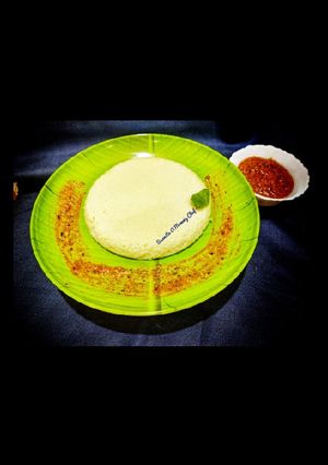 A picture of Plate idli with tomato fenugreek chutney.