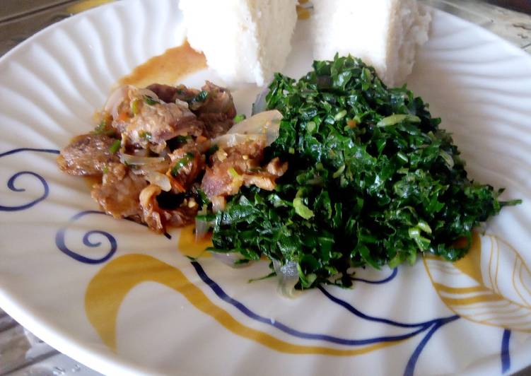Beef stew, greens served with ugali