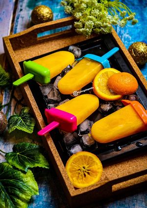 A picture of Orange lollies|Orange Popsicles.