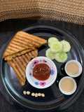 Chole bread sandwich with masala chai and cucumber