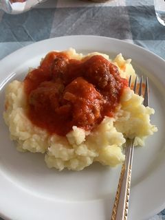 A picture of Meat Balls in Tomato Sauce.