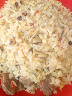 A picture of Jollofrice with beans.