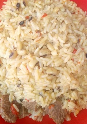 A picture of Jollofrice with beans.