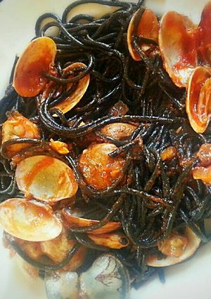 A picture of Mediterranean black pasta with clams, just delicious!.