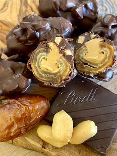 A picture of Vegan Stuffed Dates with Peanut Butter and Dark Chocolate with Sea Salt.