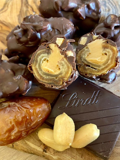 A picture of Vegan Stuffed Dates with Peanut Butter and Dark Chocolate with Sea Salt.